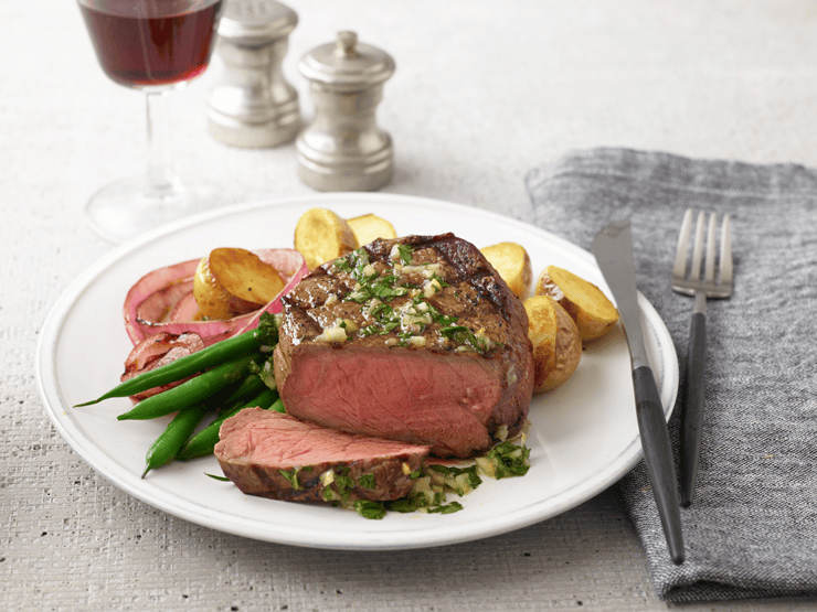 grilled steak topped with salsa verde