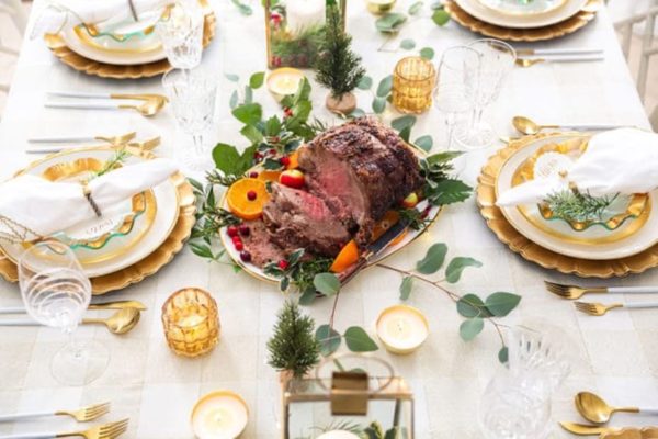 white table setting for roast with festive decor