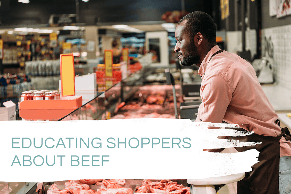 educating shopper about beef - butcher in a grocery store serving beef