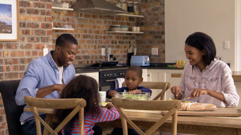 A young family enjoying a meal together